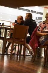 Looking under a table. Up skirt mature